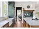 Modern kitchen featuring stainless steel appliances, custom cabinets, and stylish backsplash at 101 E Lambright St, Tampa, FL 33604