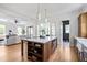 Open concept kitchen with an oversized island and view to the living room at 101 E Lambright St, Tampa, FL 33604