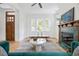 Cozy living room with a tiled fireplace, hardwood floors, lots of natural light and modern furniture at 101 E Lambright St, Tampa, FL 33604