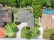 Aerial view of property showing roof, driveway, landscaping, and surrounding neighborhood at 10237 Carrin Rd, Spring Hill, FL 34608
