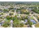 A tranquil neighborhood featuring lush greenery and various home styles, perfect for serene living at 10237 Carrin Rd, Spring Hill, FL 34608