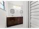 Stylish bathroom featuring double vanity with modern fixtures and plenty of storage at 10237 Carrin Rd, Spring Hill, FL 34608