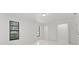 Spacious bedroom with tile flooring, closet, and natural light from multiple windows at 10237 Carrin Rd, Spring Hill, FL 34608