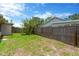 Exterior view of home with a wood fenced backyard at 11896 104Th Ln, Largo, FL 33773