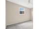 Bright bedroom with plush gray carpet at 11896 104Th Ln, Largo, FL 33773