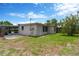 Exterior view of home with screened in porch and fenced yard at 11896 104Th Ln, Largo, FL 33773