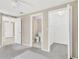 The main bedroom features neutral walls, carpet flooring, and closet with an ensuite bathroom at 11896 104Th Ln, Largo, FL 33773