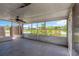 Enclosed patio features concrete floors, ceiling fan, and an opening to the outside at 11896 104Th Ln, Largo, FL 33773