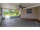 View of screened porch with ceiling fan at 11896 104Th Ln, Largo, FL 33773