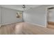 Neutral bedroom featuring new floors, paint, a ceiling fan, and window at 1214 Haddington Cir # 1214, Sun City Center, FL 33573