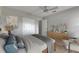 Staged bedroom featuring stylish décor, furniture, and adjacent bathroom at 1214 Haddington Cir # 1214, Sun City Center, FL 33573
