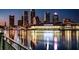 Brightly lit urban skyline reflecting on the water in the city at 1214 Haddington Cir # 1214, Sun City Center, FL 33573