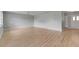 Bright empty room with neutral walls, wood-look floors, ceiling fan, and recessed lighting at 1214 Haddington Cir # 1214, Sun City Center, FL 33573