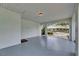 Inviting covered entrance featuring updated flooring and stylish lighting fixtures at 1214 Haddington Cir # 1214, Sun City Center, FL 33573