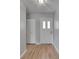 Inviting entryway with wood-look floors, coat closet, and a front door with sidelights at 1214 Haddington Cir # 1214, Sun City Center, FL 33573