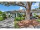 Charming home featuring mature landscaping, and inviting covered entrance with beautiful, natural shade at 1214 Haddington Cir # 1214, Sun City Center, FL 33573
