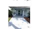 Charming home featuring a covered front entrance with decorative columns and a spacious driveway at 1214 Haddington Cir # 1214, Sun City Center, FL 33573