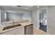 Bright kitchen featuring stainless steel appliances and stunning white and gray granite countertops at 1214 Haddington Cir # 1214, Sun City Center, FL 33573