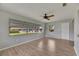 Living room featuring updated flooring, neutral paint and many windows at 1214 Haddington Cir # 1214, Sun City Center, FL 33573
