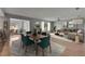 Open-concept living and dining area with wood floors and a modern design at 1214 Haddington Cir # 1214, Sun City Center, FL 33573