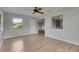 Open living room with new floors and a view into the updated kitchen at 1214 Haddington Cir # 1214, Sun City Center, FL 33573