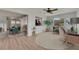 Bright and airy living space with elegant decor, seamlessly connecting the dining and living areas at 1214 Haddington Cir # 1214, Sun City Center, FL 33573