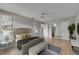 Spacious main bedroom with modern decor and en-suite bathroom with ample natural light at 1214 Haddington Cir # 1214, Sun City Center, FL 33573
