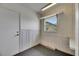 Bright bonus room with door to exterior, a window, and paneled walls at 1214 Haddington Cir # 1214, Sun City Center, FL 33573