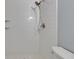 Modern tiled shower showcasing elegant fixtures and pristine white subway tile at 1214 Haddington Cir # 1214, Sun City Center, FL 33573