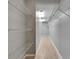 Long walk-in closet with shelving and laminate floors at 1214 Haddington Cir # 1214, Sun City Center, FL 33573