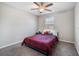 Bedroom featuring a ceiling fan, a window, and a black bed frame at 1218 Grantham Dr, Sarasota, FL 34234