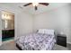 Bedroom featuring a ceiling fan, a window, and a black nightstand at 1218 Grantham Dr, Sarasota, FL 34234