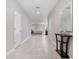 Bright foyer featuring tile floors, neutral paint, and a view to the living room at 1218 Grantham Dr, Sarasota, FL 34234