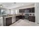 Spacious kitchen with stainless steel appliances and dark cabinetry at 1218 Grantham Dr, Sarasota, FL 34234