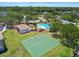 A pool, clubhouse, and basketball court are surrounded by lush greenery at 12472 Country White Cir, Tampa, FL 33635