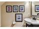 Tastefully decorated half-bath featuring unique artwork and modern fixtures at 12472 Country White Cir, Tampa, FL 33635