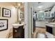 Bathroom and kitchen displaying a convenient layout and seamless access at 12472 Country White Cir, Tampa, FL 33635