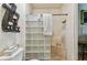 Modern bathroom features a glass block shower, tiled walls, and decorative accents at 12472 Country White Cir, Tampa, FL 33635