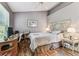 Serene bedroom featuring hardwood floors, a ceiling fan, and ample natural light at 12472 Country White Cir, Tampa, FL 33635