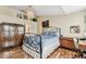 Comfortable bedroom with a chandelier, hardwood floors, and ample natural light at 12472 Country White Cir, Tampa, FL 33635