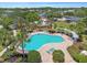 Relax by the community pool surrounded by tropical landscaping in this inviting community at 12472 Country White Cir, Tampa, FL 33635