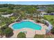 Enjoy the Florida sun in this community pool with ample seating and shaded pergola at 12472 Country White Cir, Tampa, FL 33635