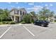 Charming two-story townhouse with well-maintained landscaping and assigned parking spaces at 12472 Country White Cir, Tampa, FL 33635