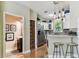 Kitchen and bathroom showing modern appliances, breakfast bar and access to half bath at 12472 Country White Cir, Tampa, FL 33635