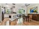 Open kitchen with breakfast bar that complements dining area and living space at 12472 Country White Cir, Tampa, FL 33635
