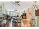 Bright open-concept living and dining area featuring hardwood floors and unique decor at 12472 Country White Cir, Tampa, FL 33635
