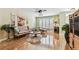 Inviting living room featuring hardwood floors and plenty of comfortable seating at 12472 Country White Cir, Tampa, FL 33635