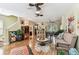 Open-concept living space with hardwood floors, neutral tones, and ample natural light at 12472 Country White Cir, Tampa, FL 33635