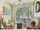 Cozy sitting area with white shutters, soft natural light, and a ceiling fan at 12472 Country White Cir, Tampa, FL 33635