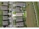 Aerial view of a home's backyard highlighting a patio with a pergola, a fenced yard, and well-manicured landscaping at 12643 Shetland Walk Dr, Lithia, FL 33547